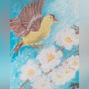 Canvas print of a finch landing on flowers